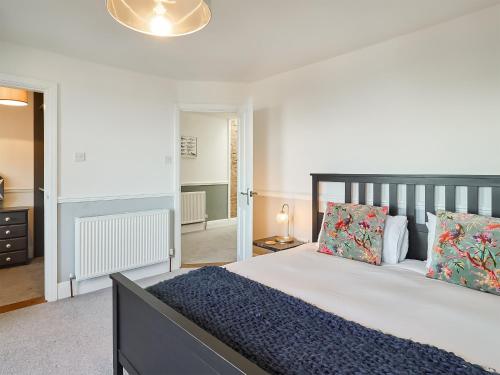 a bedroom with a large bed in a room at Belmont House in Broadstairs
