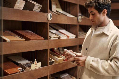 a man standing in a store looking at a shelf at The Chedi El Gouna in Hurghada