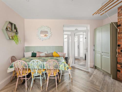 a dining room with a table and chairs at Chapter Meadow in Worcester