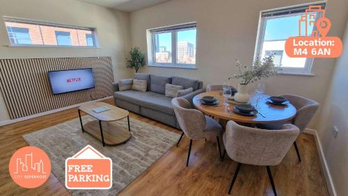 a living room with a couch and a table at Free Parking City Centre Flat by City SuperHost in Manchester