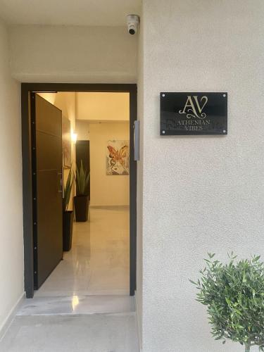 a sign on the side of a building at ATHENIAN Vibes in Athens