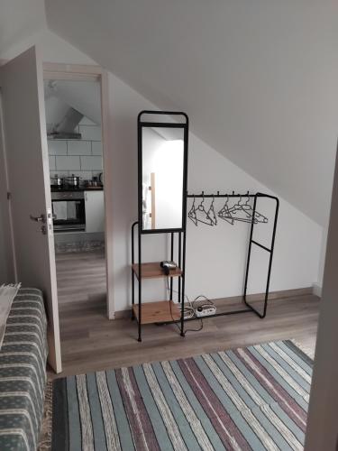 a mirror on a stand in a room at MM House in Bicas
