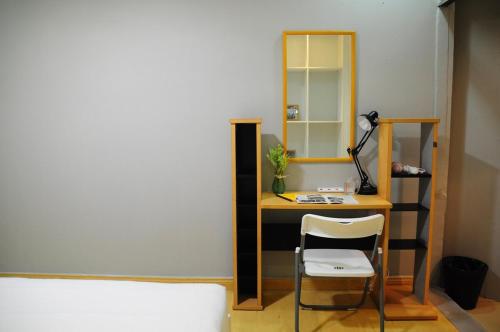 a room with a desk with a chair and a mirror at GRAYHAUS BU4 5BR House - Bandar Utama, near 1 Utama - Stay Only NO EVENTS in Petaling Jaya