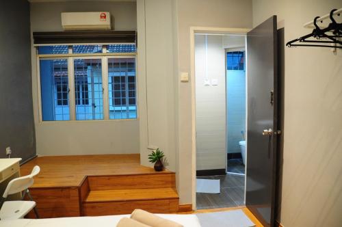 a room with a bed and a desk and a window at GRAYHAUS BU4 5BR House - Bandar Utama, near 1 Utama - Stay Only NO EVENTS in Petaling Jaya