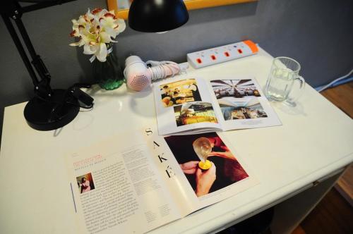 a table with an open book on top of it at GRAYHAUS BU4 5BR House - Bandar Utama, near 1 Utama - Stay Only NO EVENTS in Petaling Jaya