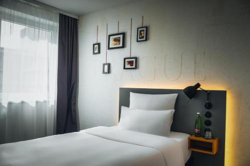 Кровать или кровати в номере Hotel PULSE8
