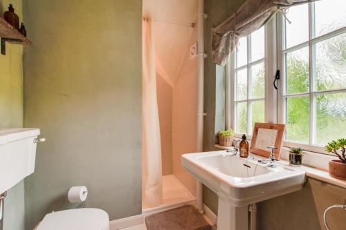 a bathroom with a sink and a shower at Woodside in Windley