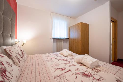 Letto o letti in una camera di Hotel il Caminetto Sport
