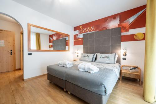 Letto o letti in una camera di Hotel il Caminetto Sport