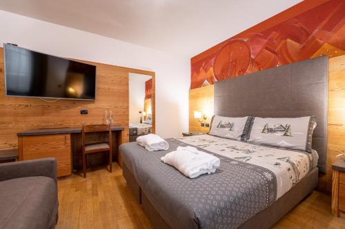 Letto o letti in una camera di Hotel il Caminetto Sport