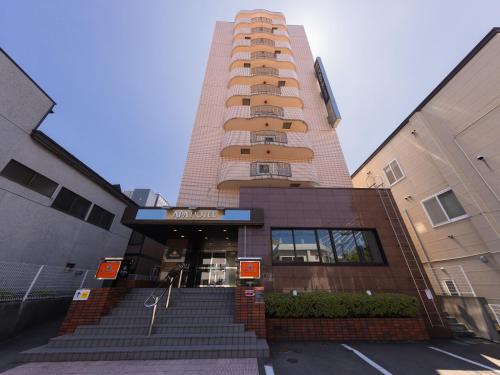 a tall building with stairs in front of it at APA Hotel Aomori Ekihigashi in Aomori
