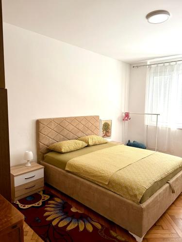 a bedroom with a large bed in a room at Center Oasis Retreat in Podgorica