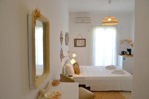 Katil atau katil-katil dalam bilik di Heliotropio Studios & Apartments