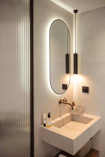 a bathroom with a sink and a mirror at Villa Yoma- Luxury Villa with Heated Pool in Epáno Kefalás