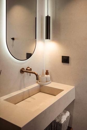 a bathroom with a sink and a mirror at Villa Yoma- Luxury Villa with Heated Pool in Epáno Kefalás