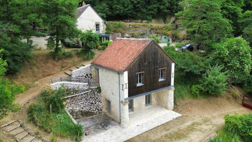 an overhead view of a small house on a hill at Cottage en nature Le Pigeonnier de la Manse in Saint-Épain
