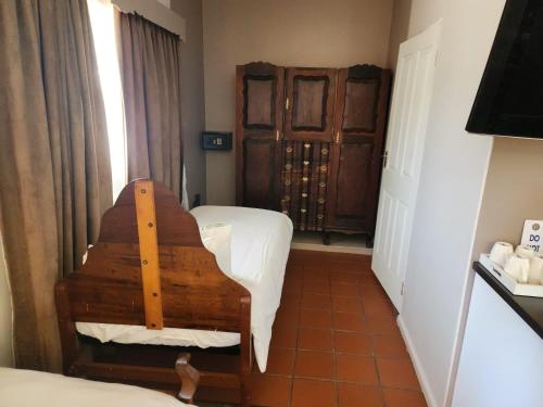Postel nebo postele na pokoji v ubytování Okiep Country Hotel