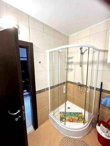 a shower with a glass enclosure in a room at Sirena Appartment in Sveti Vlas