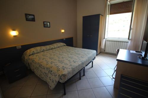Postel nebo postele na pokoji v ubytování Albergo La Mimosa