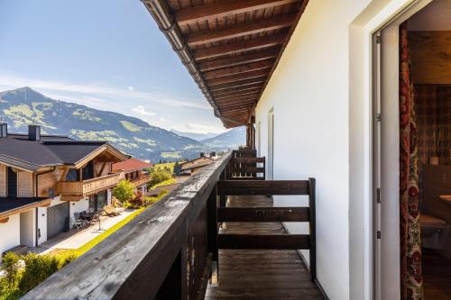 a balcony with a view of the mountains at Pension Heidelberg in Hopfgarten im Brixental