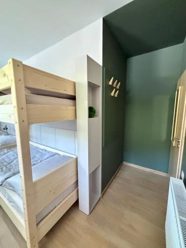 a bunk bed in a room with a bunk bedutenewayangering at el Gotel in Čadca