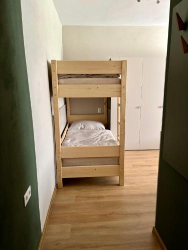 a bunk bed in the corner of a room at el Gotel in Čadca