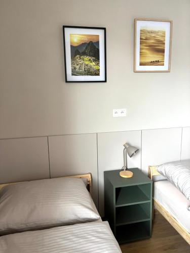 a bedroom with a bed and a lamp on a night stand at el Gotel in Čadca