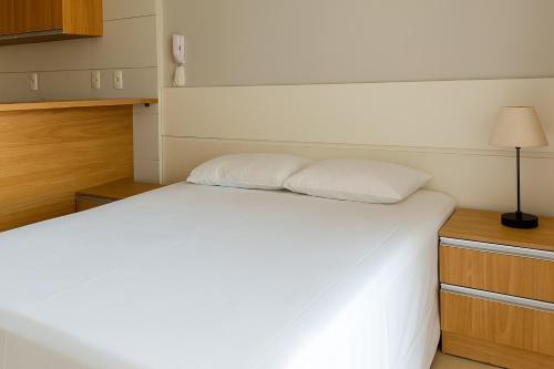 Postel nebo postele na pokoji v ubytování Flat Vila Atlântida 311B