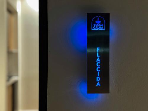 a blue and black sign on a door at Yucca Calma in Rhodes Town