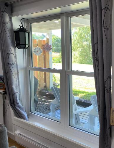a window with a view of a patio at Our Place Up North BnB in Huntsville