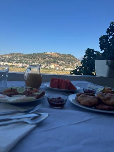 a table with plates of food on top of it at The Horizon in Berat