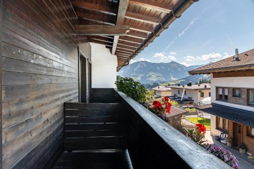 a view from the balcony of a house with stairs at Pension Heidelberg in Hopfgarten im Brixental