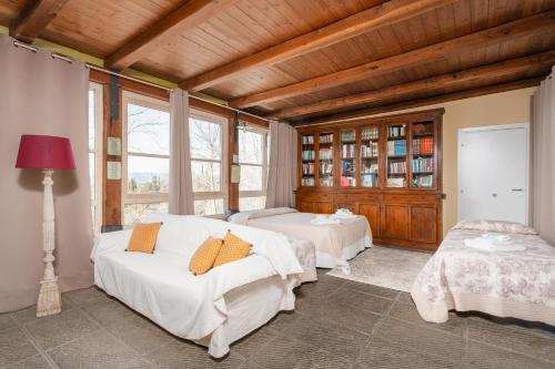 a bedroom with two beds in a room at Alpaca country house in Pontedera