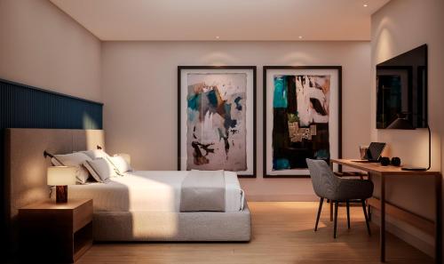 Un dormitorio con una cama y un escritorio con una silla. en The Lince Braga, en Braga