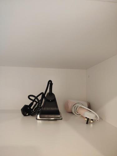 a kitchen counter with a lamp and a telephone at Timurbay Seafront By Moonlight in Kuantan