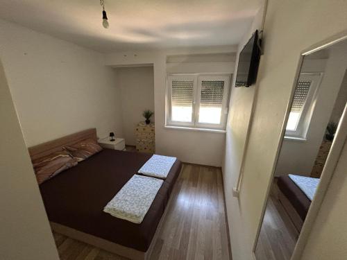 Ένα ή περισσότερα κρεβάτια σε δωμάτιο στο Apartman Papac