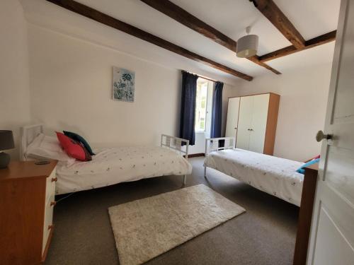 Katil atau katil-katil dalam bilik di The Coach House-3 Bed-2 Bath-Garden-PetsOK-FreeP