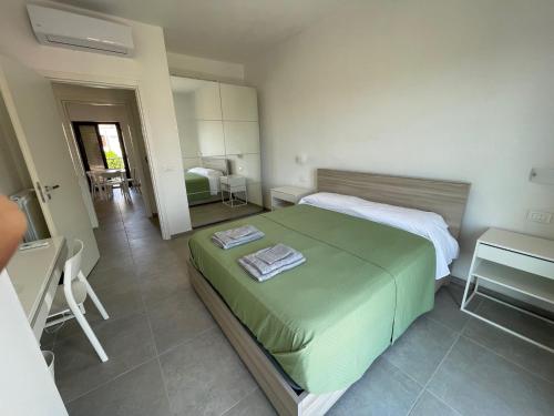 Postel nebo postele na pokoji v ubytování Stretto Apartment