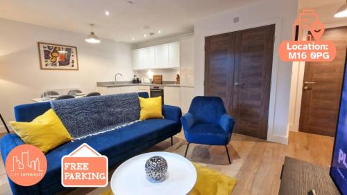 a living room with a blue couch and a kitchen at Free Parking. Old Trafford Home in Manchester