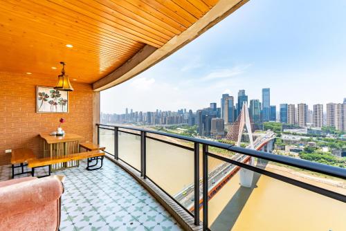 a balcony with a view of the city at Misty Nest High Altitude River View B&B Hongyadong Branch in Chongqing