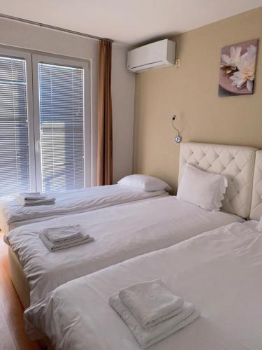 Postel nebo postele na pokoji v ubytování Hotel Vittore