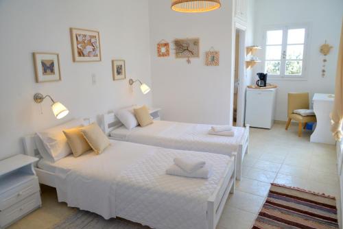 Katil atau katil-katil dalam bilik di Heliotropio Studios & Apartments