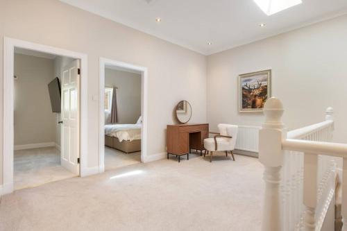 a bedroom with a bed and a desk in a room at Balbirnie Mill, Brechin. in Angus