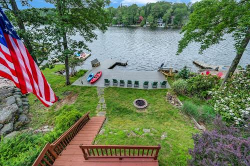 an aerial view of a lake with an american flag at beautiful lakefront lodge in Lake Harmony