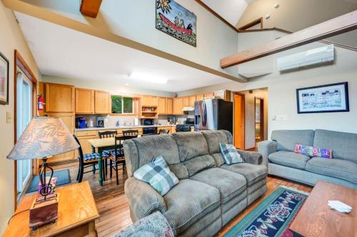 a living room with a couch and a table at beautiful lakefront lodge in Lake Harmony