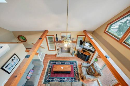 an overhead view of a living room with a staircase at beautiful lakefront lodge in Lake Harmony