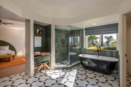 a bathroom with a tub and a shower at The Grape Escape Panoramic Views In Wine Country in Temecula