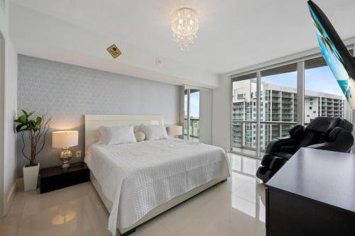 Ένα ή περισσότερα κρεβάτια σε δωμάτιο στο Icon Brickell Condo with Pool, Spa, Gym and City Views