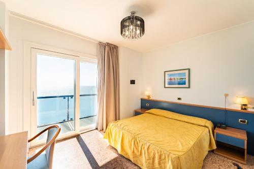 Postel nebo postele na pokoji v ubytování Hotel Souvenir