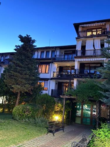 a building with a bench in front of it at Marena Studio - Santa Marina, Sozopol in Sozopol